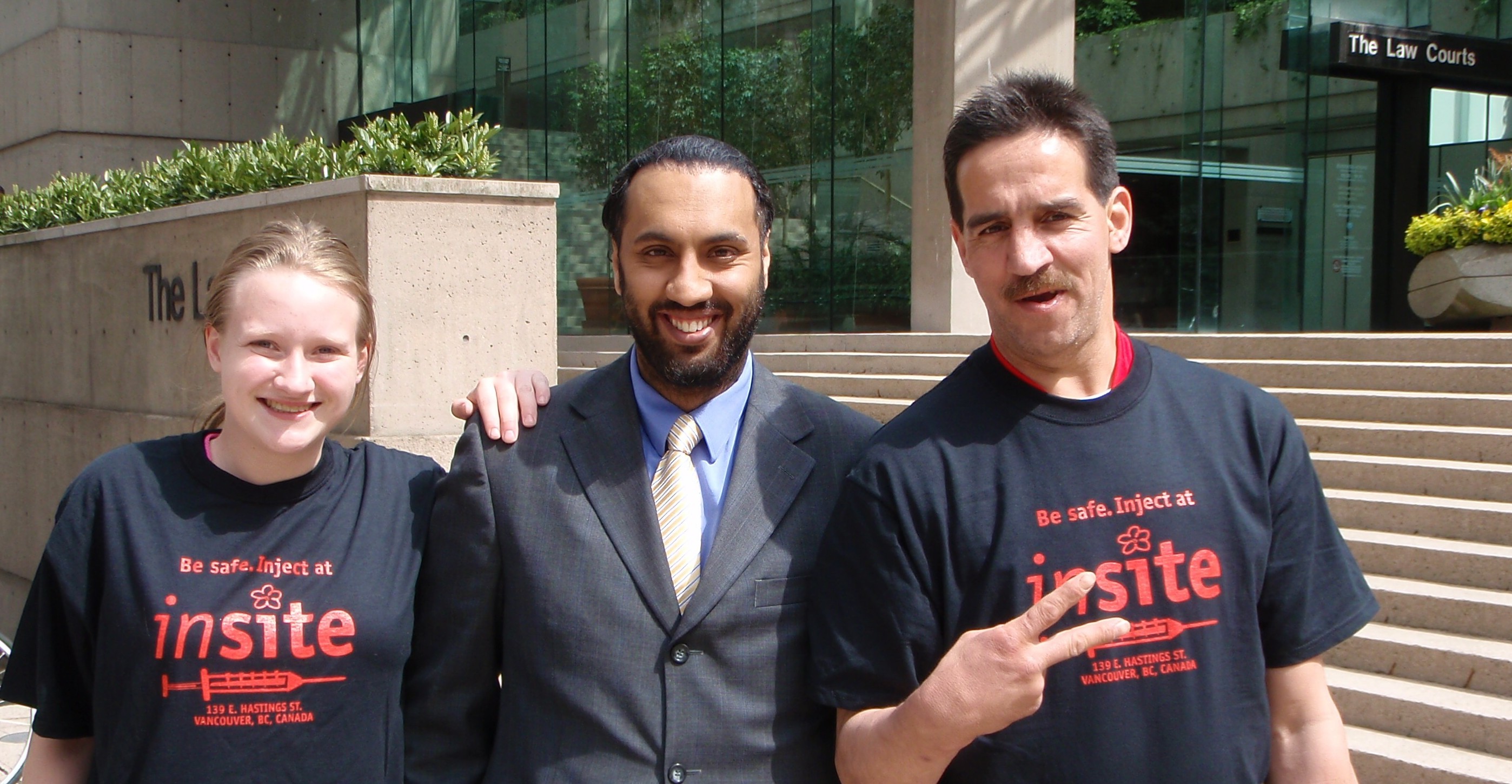 Omar Ha-Redeye with two Vancouver residents who find Insite's service useful